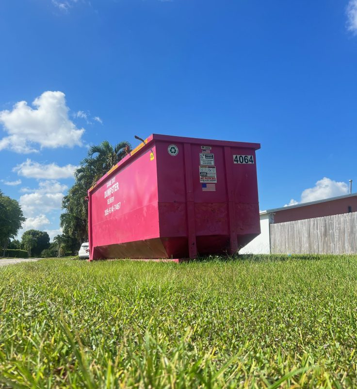 Roll off dumpster ready for debris removal at a South Florida job site